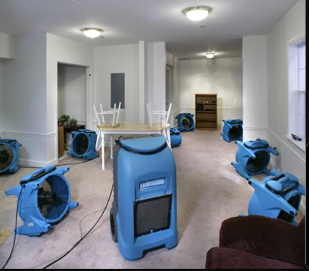 Air movers and dehumidifier setup for Water Damage Restoration in Sienna